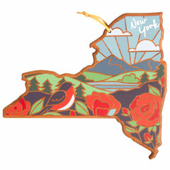 The Totally Bamboo New York Cutting Board with Artwork by Summer Stokes combines functionality and artistry, featuring a state-shaped wooden design adorned with an illustration of a sunrise over mountains, a bird, red roses, and a blue sky with clouds. "New York" elegantly decorates the top right corner.