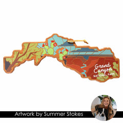 Experience the vibrant landscape of Grand Canyon National Park with this unique cutting board, adorned with colorful map-shaped artwork by artist Summer Stokes. The design features picturesque scenery, cacti, and the park's name in elegant cursive on a premium bamboo surface from Totally Bamboo. Featured below is a circular inset photo of the smiling artist, Summer Stokes, accompanied by her dog.