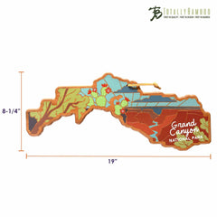 The Grand Canyon Cutting Board with Artwork by Summer Stokes, created from a bamboo surface, is 19 inches wide and 8-1/4 inches tall. It features vibrant illustrations of the canyon and surrounding foliage. The "Totally Bamboo" brand logo is elegantly placed in the top right corner.