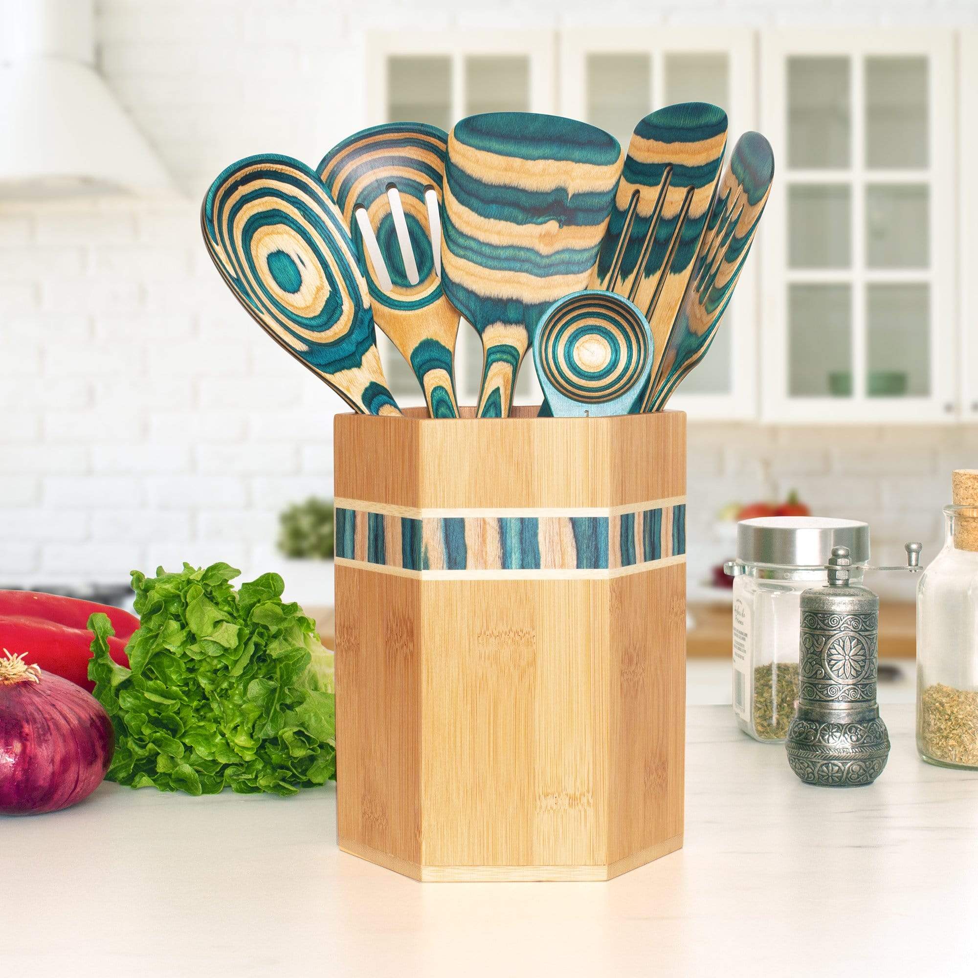 Add a splash of cool color to your kitchen with the Baltique Mykonos  Collection Cooking Spoon with Spoon Rest Notch. This eye-catching utensil  is masterfully crafted from layers of colored birch wood