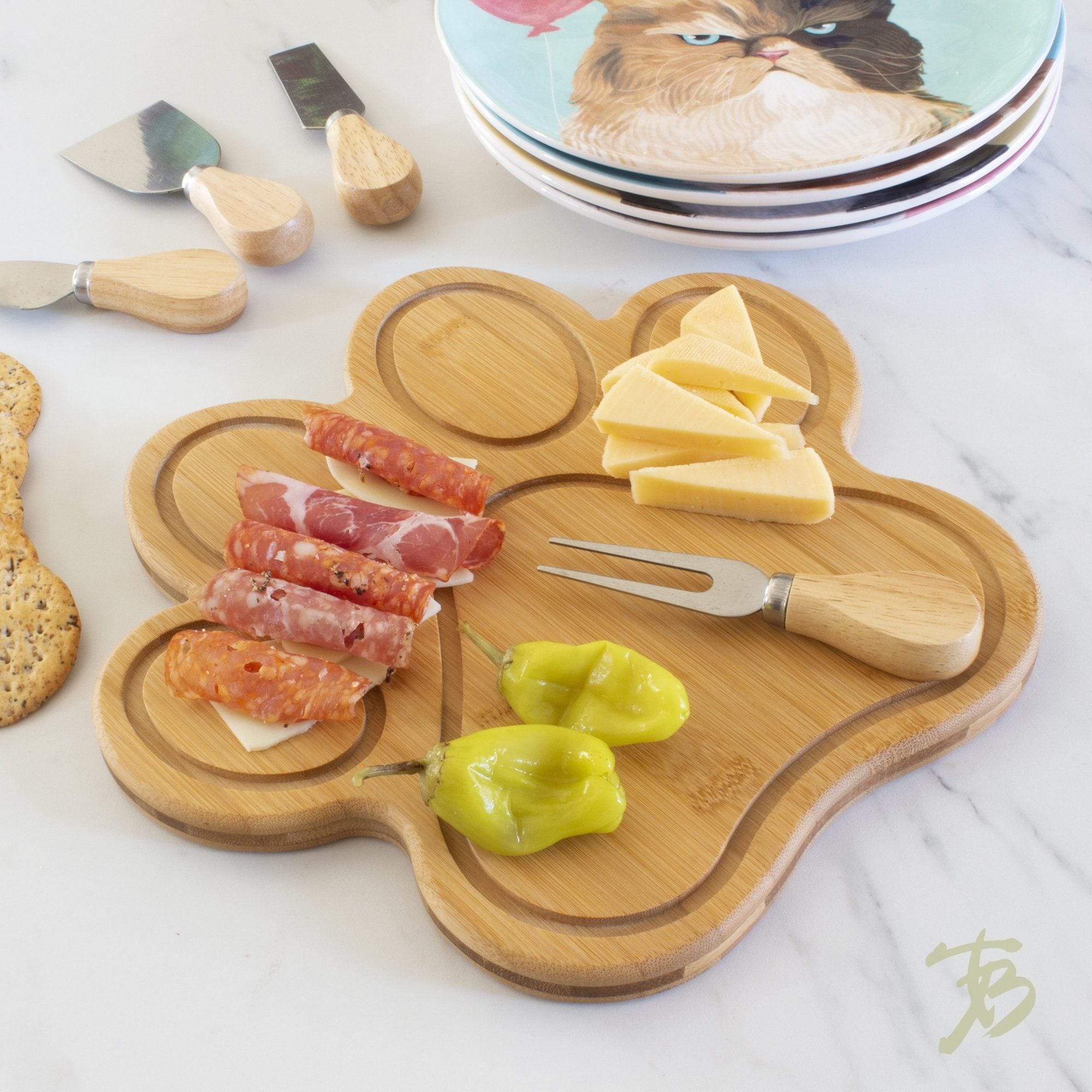 https://totallybamboo.com/cdn/shop/products/paw-shaped-serving-and-cutting-board-11-x-10-totally-bamboo-103320.jpg?v=1628051477