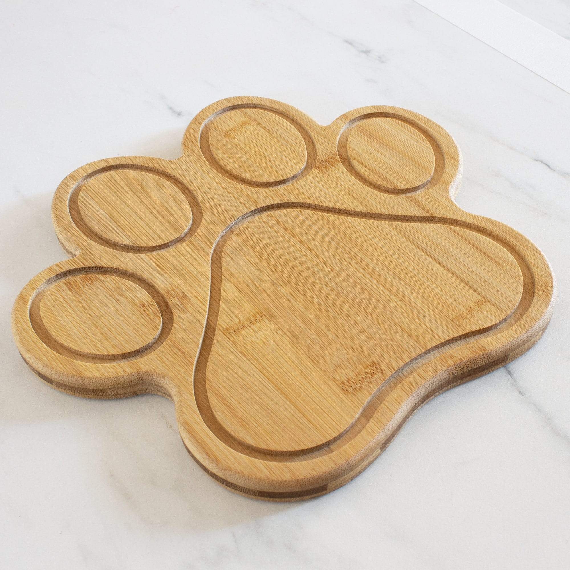 https://totallybamboo.com/cdn/shop/products/paw-shaped-serving-and-cutting-board-11-x-10-totally-bamboo-787452.jpg?v=1627996223