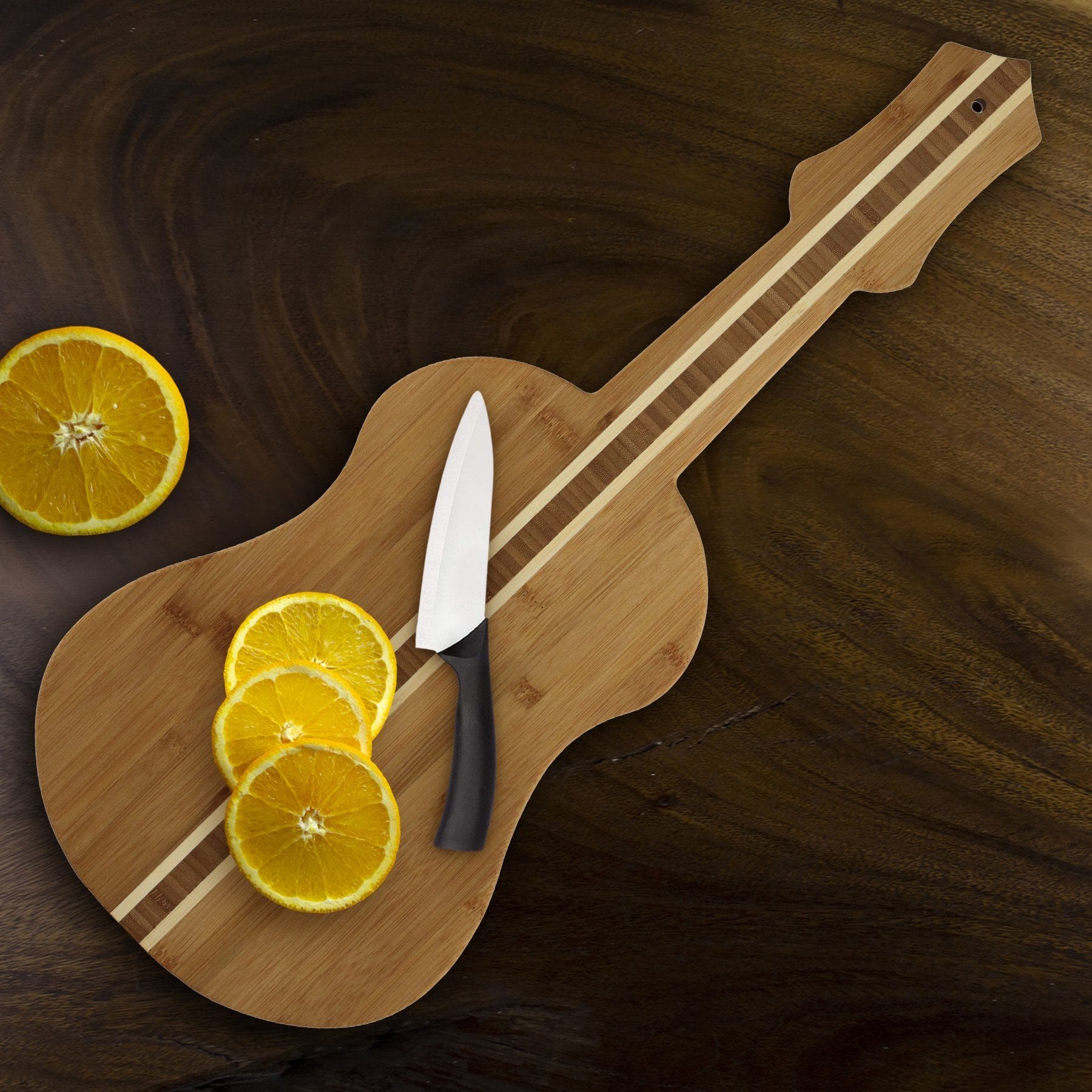 https://totallybamboo.com/cdn/shop/products/ukulele-shaped-serving-and-cutting-board-22-x-9-totally-bamboo-300245.jpg?v=1624431128